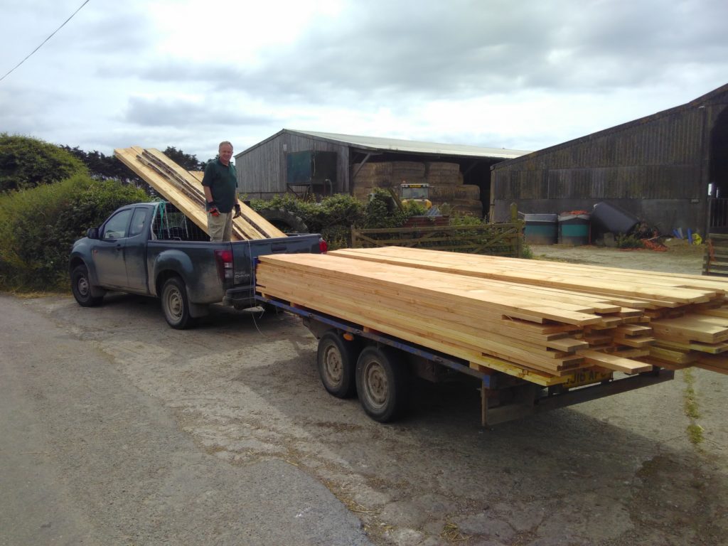 Pick-up and trailer load of larch