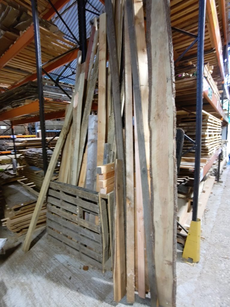 Assorted lengths of different types and section sizes of timber